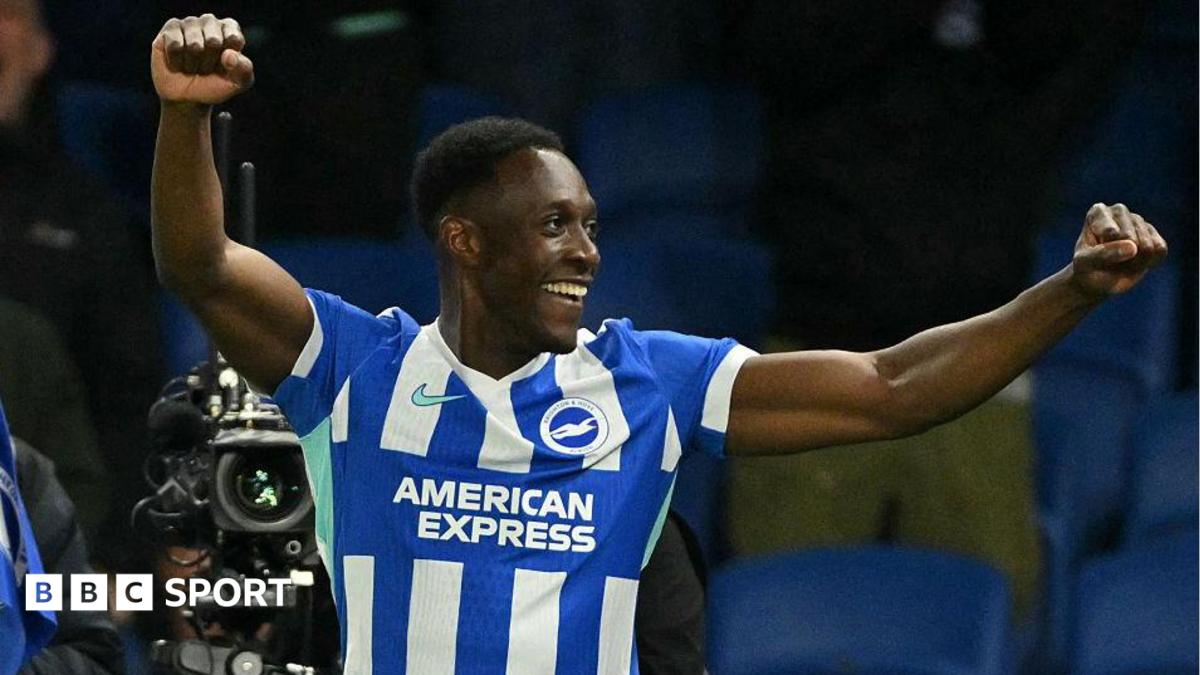 Danny Welbeck punches the air with both hands after scoring for Brighton