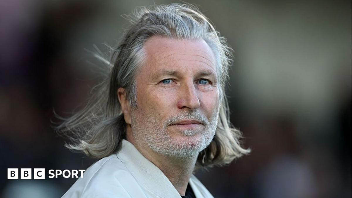Robbie Savage looks on during a Forest Green Rovers match