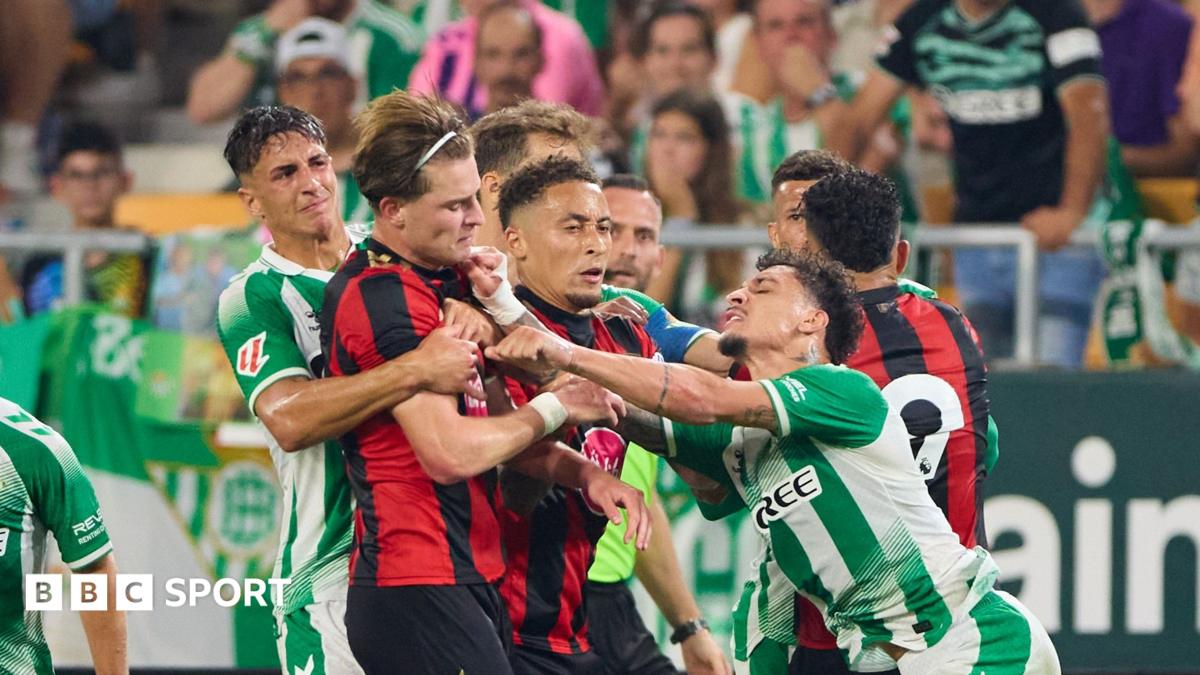 Antony of Real Betis fights with Alex Scott of AFC Bournemouth during the pre-season friendly