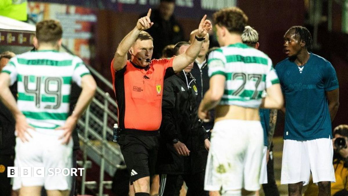 Referee John Beaton signals for a penalty after reviewing the incident