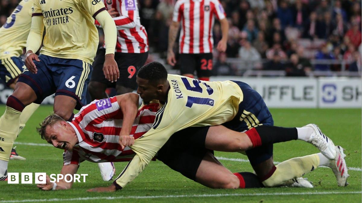 Dan Ballard and Ezri Konsa go down in the penalty area