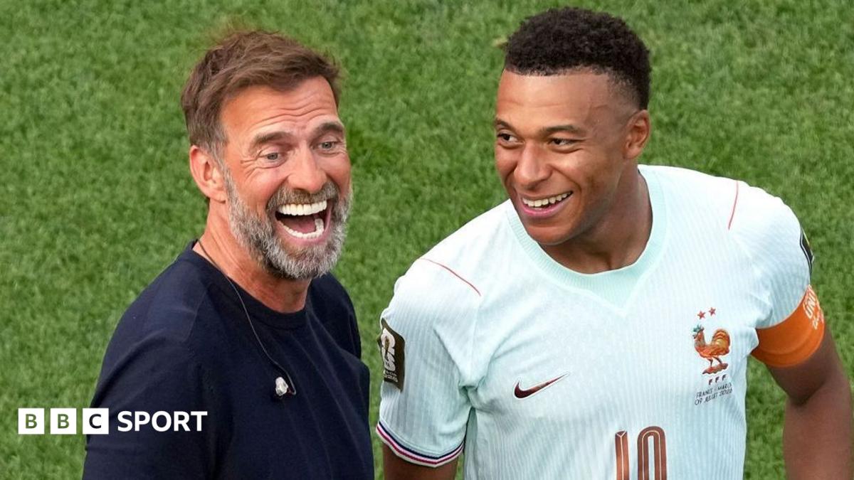 Kylian Mbappe of France and Jurgen Klopp are seen after the World Cup quarter-final match between France and Morocco